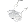 Load image into Gallery viewer, Back of asymmetric hexagonal pendant with a brushed matte sterling silver finish. Logo saying Zed Eh is stamped on edge of pendant, in black. Sqaure link chain attached to pendant is blurred in photo
