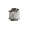 Load image into Gallery viewer, Back of sterling silver overlapping wrap ring with melted edges and an oxidized rustic surface texture. 
