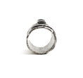 Load image into Gallery viewer, Sterling silver overlapping wrap ring, with melted edges and an oxidized rustic surface texture. Ring is on its side, showing the interior of the band and the profile of the square, translucent, blue moonstone roughly bezel set in the center of the ring.
