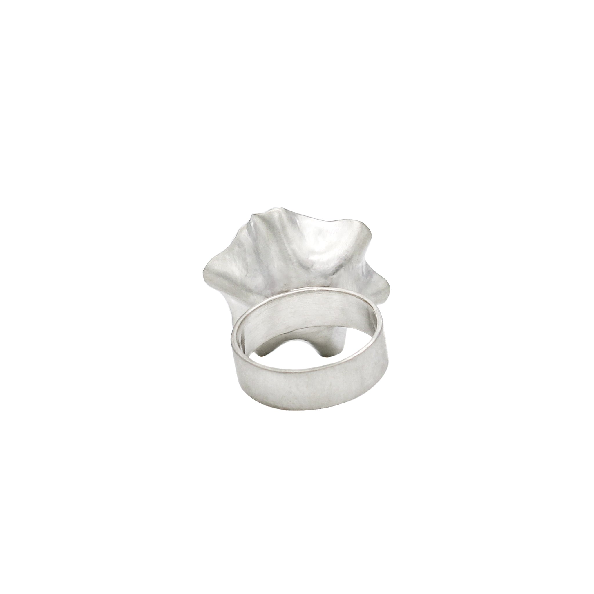 Back of unique, hand  crafted, sterling silver flower ring with a wide band, and a brushed matte finish.