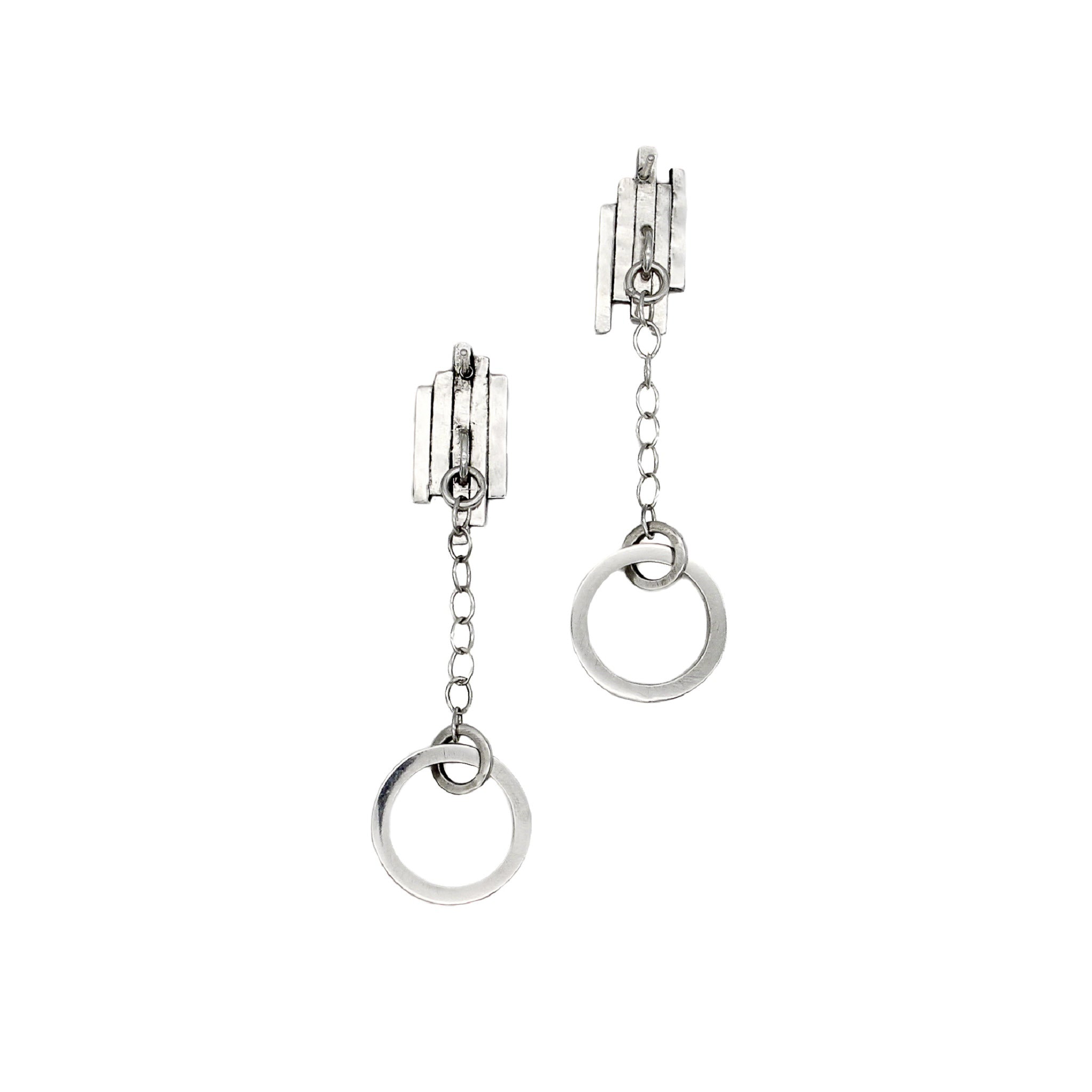 The back of a pair of handmade unique sterling silver earrings, with a hoop, hanging from a cable chain, attached to 5 staggered rectangular bars in a row. An ear post is attached to the back of the 5 bars. 