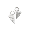 Load image into Gallery viewer, A unique pair of handmade silver earrings, each a rough triangular shape with a textured surface resembling ice. They are suspended from a sterling ring attached to ear posts.
